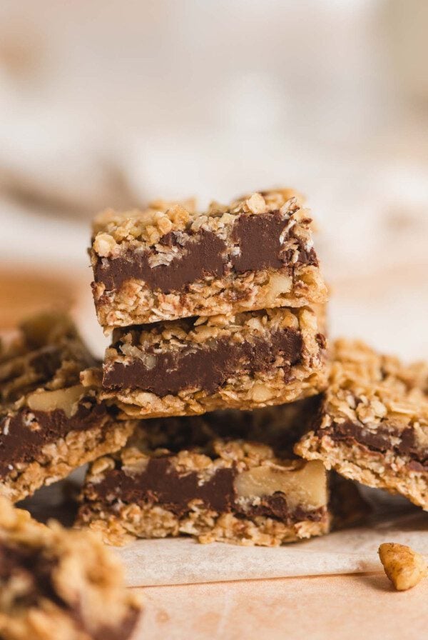 A stack of 3 Starbucks-copycat oat fudge bars with layers of chocolate fudge between layers of oat crust and crumble.