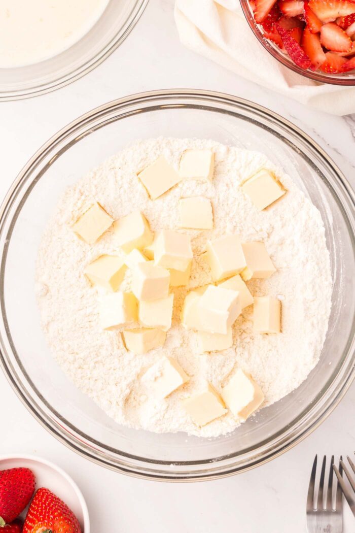 Cubed butter in a bowl of flour.