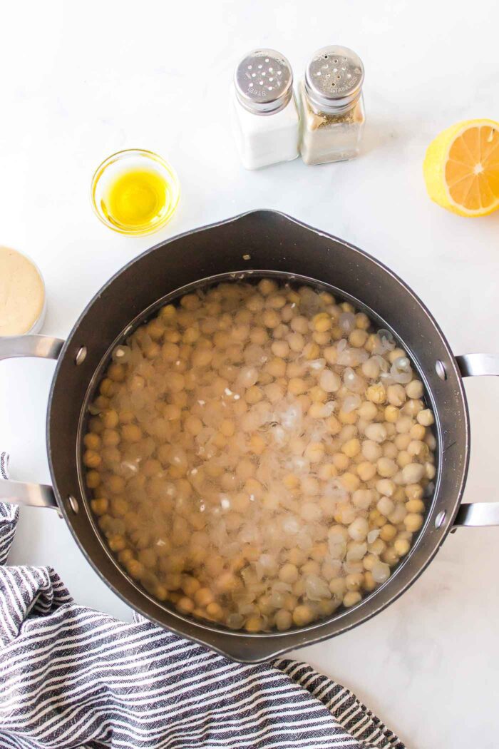 A pot of chickpeas in water.