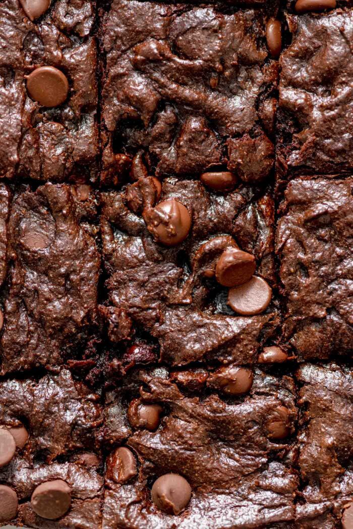Overhead close up few of chocolate chip brownies in a pan.