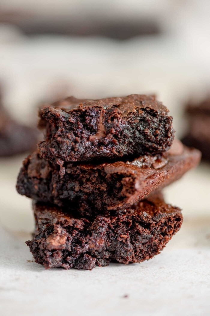 A stack of 3 chocolate chip brownies.