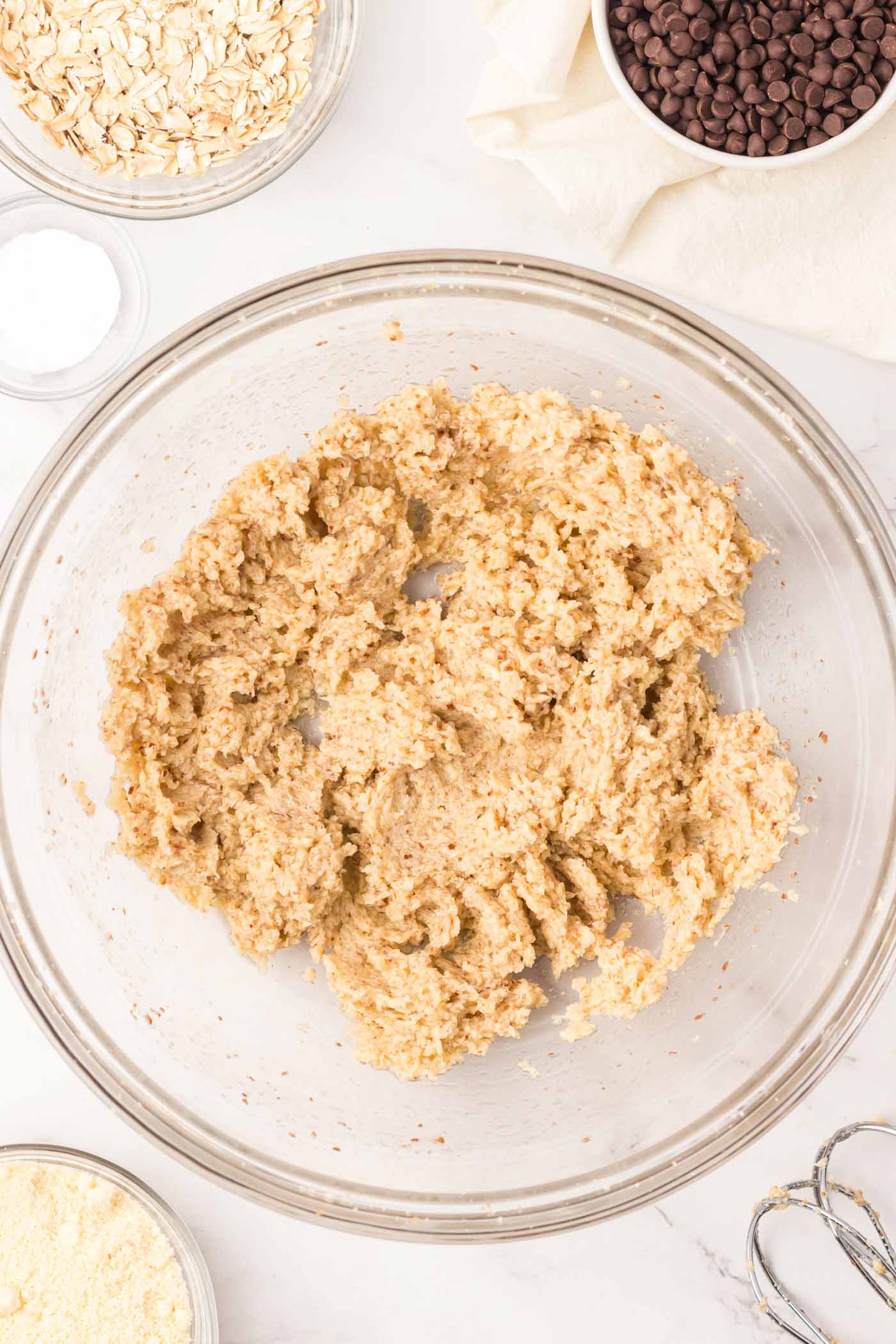 Creamed butter and sugar with ground flax in it in a mixing bowl.