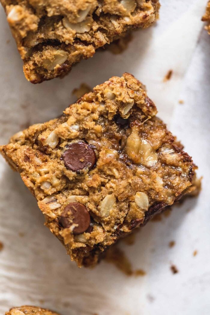 Close up of an oatmeal banana cookie bar with chocolate chips in it.