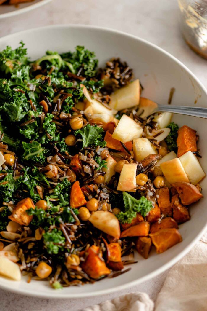 A mixed up harvest bowl that's a copycat of the Sweegreen restaurant chain with kale, chickpeas, apple and sweet potato.