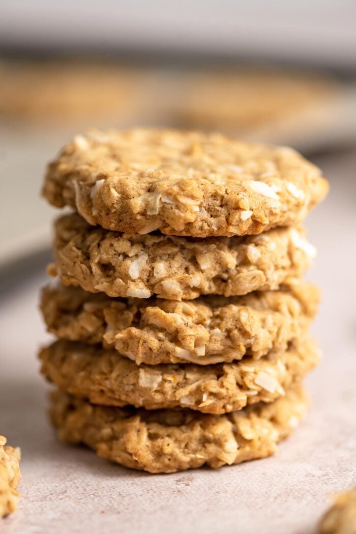 A stack of 5 crispy coconut oatmeal cookies.