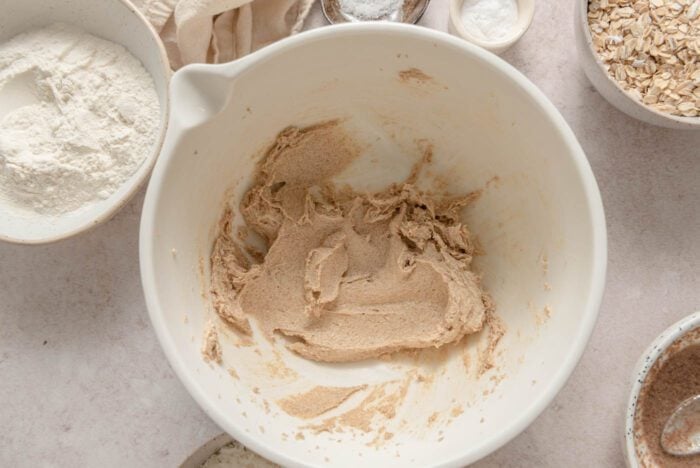 Butter and brown sugar creamed together in a large mixing bowl.