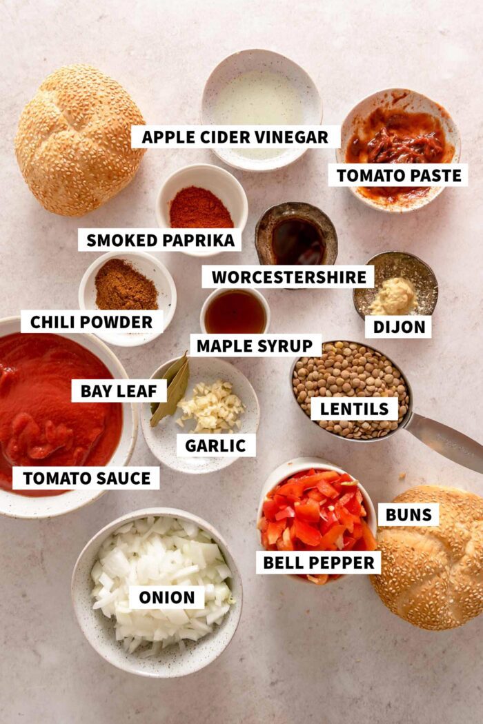 All the ingredients needed for making a vegan sloppy joe recipe with lentils and tomato sauce. Each ingredient is labelled with text.