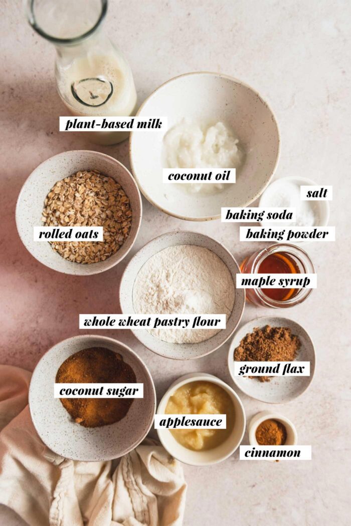 All the ingredients needed for a healthy vegan oatmeal muffins recipe. Each ingredient is labelled with text overlay and the list can be found on the corresponding blog page.