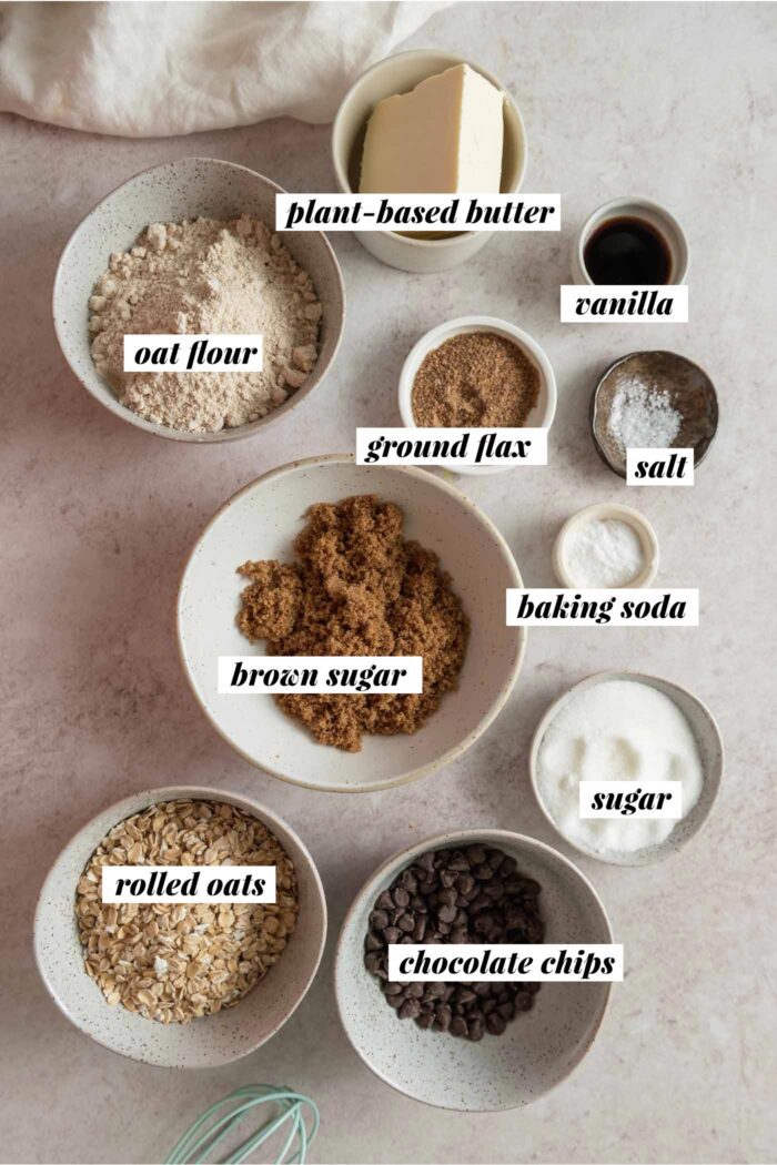 Ingredients for oatmeal cookie bars gathered in various bowls and each labelled with text overlay.