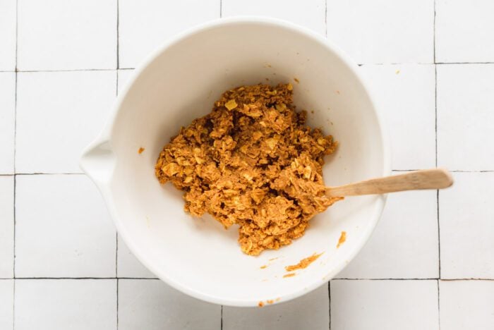 The doughy filling made from peanut butter and corn flakes for making homemade butterfingers in a bowl.