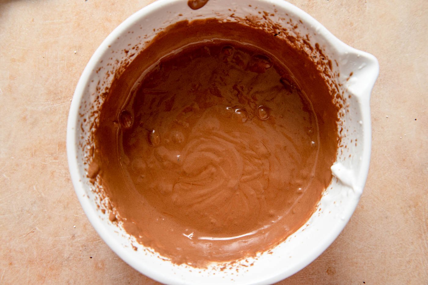 Creamy melted chocolate mixture in a large mixing bowl.