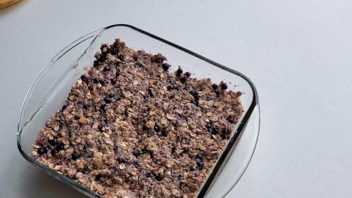 Glass baking dish of blueberry quinoa breakfast bars.