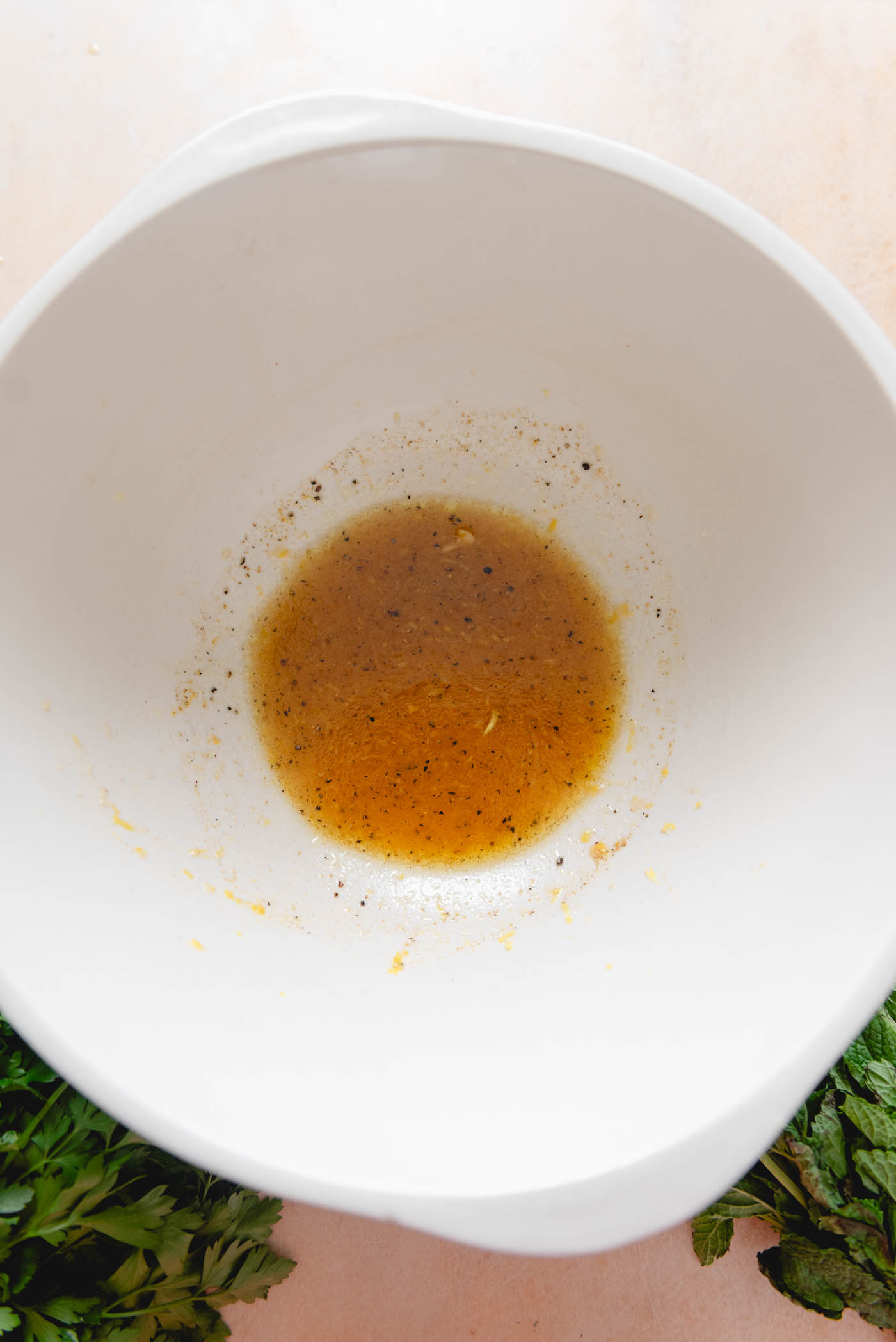 Lemon vinaigrette in a large bowl.