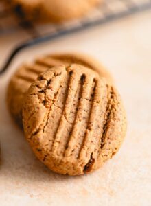 Peanut butter cookie with fork marks on top.