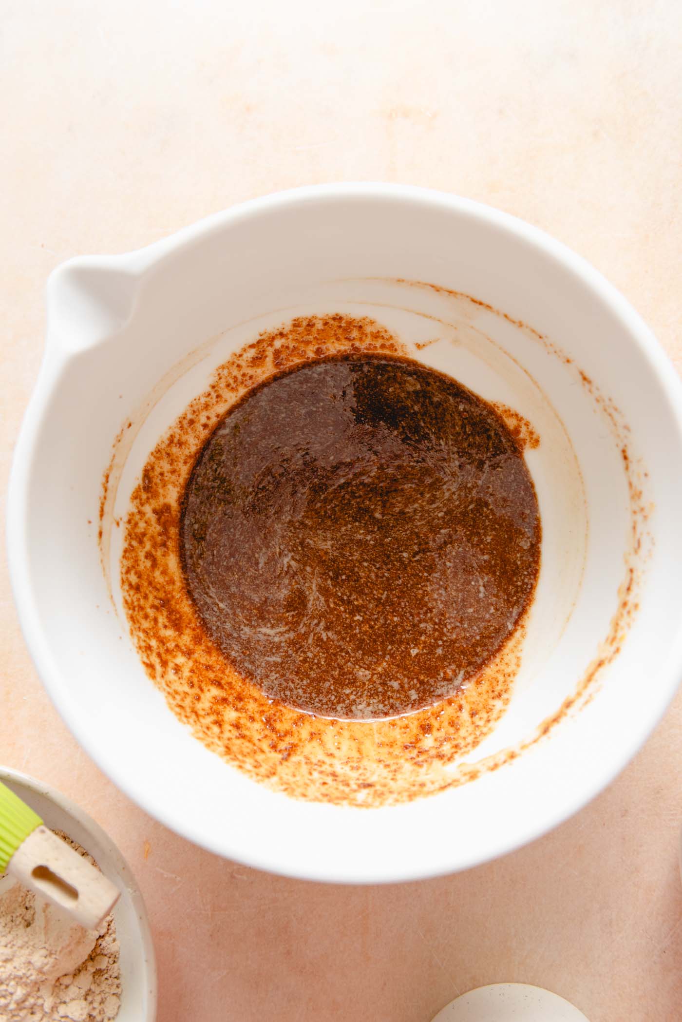 Coconut sugar, butter, flax and vanilla mixed in a mixing bowl.