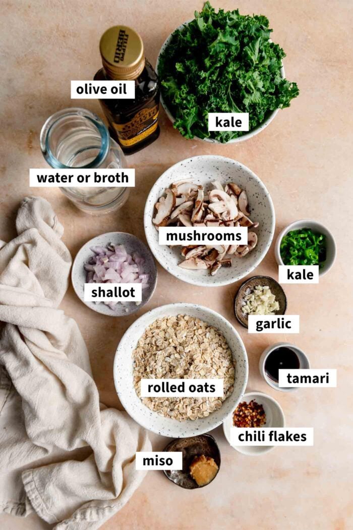 Ingredients for making savory breakfast oats with mushrooms and kale, each labelled.