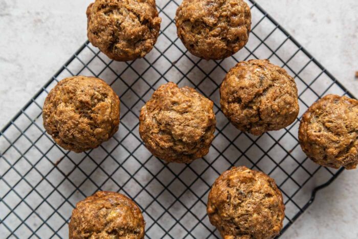 Banana walnut muffins on a wire cooling rack.