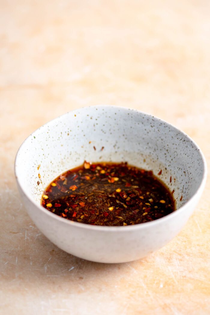Small dish of dark, soy sauce-based salad dressing.
