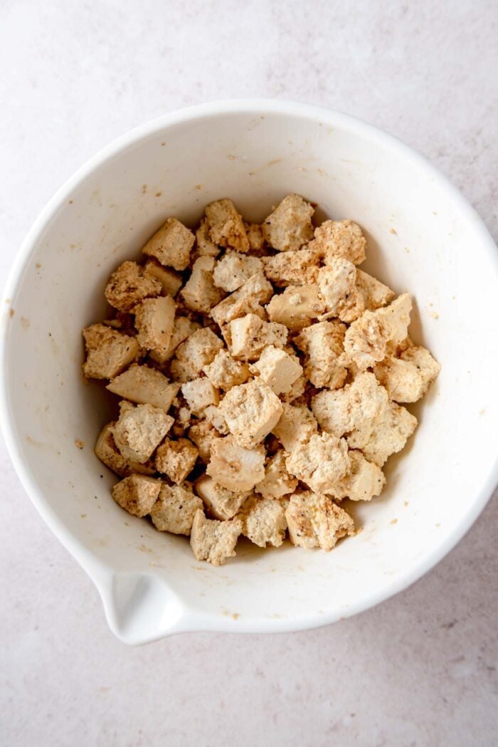 Chunks of tofu mixed with some soy sauce and black pepper.