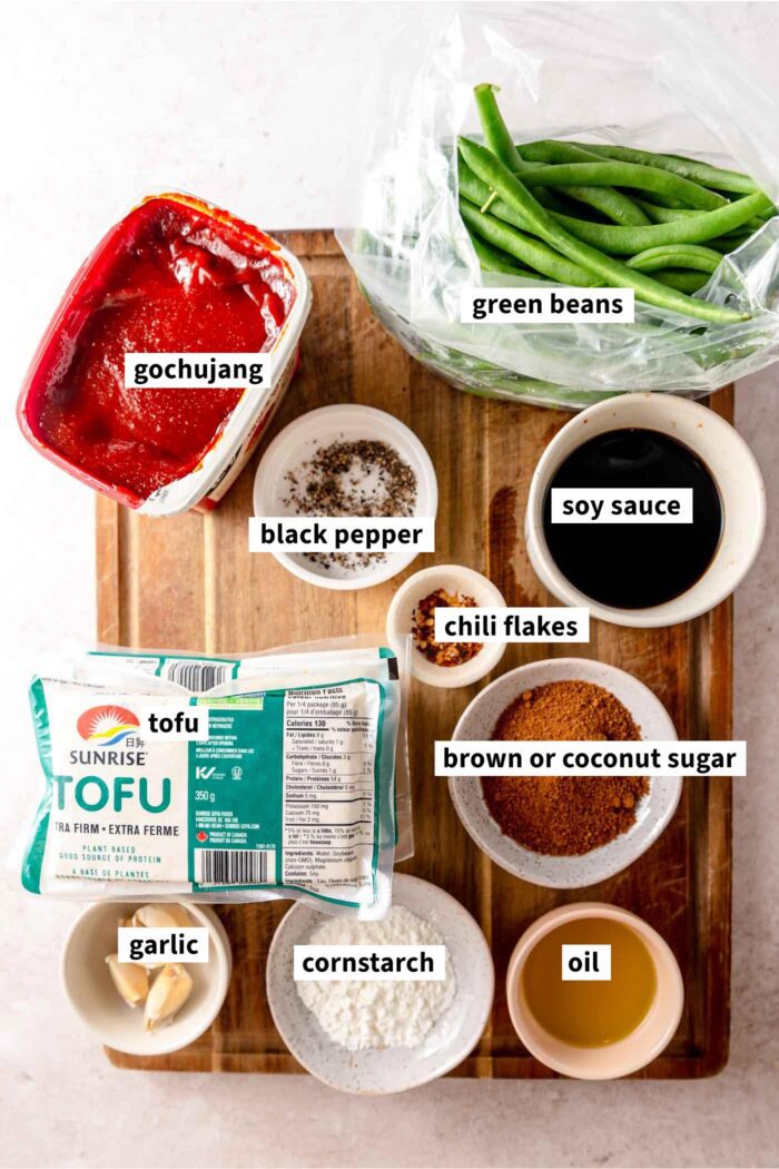 All the ingredients for making a spicy gochujang tofu recipe with green beans and rice.