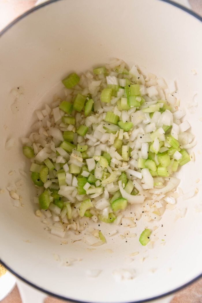 Celery, onion and garlic cooking in a large pot.

