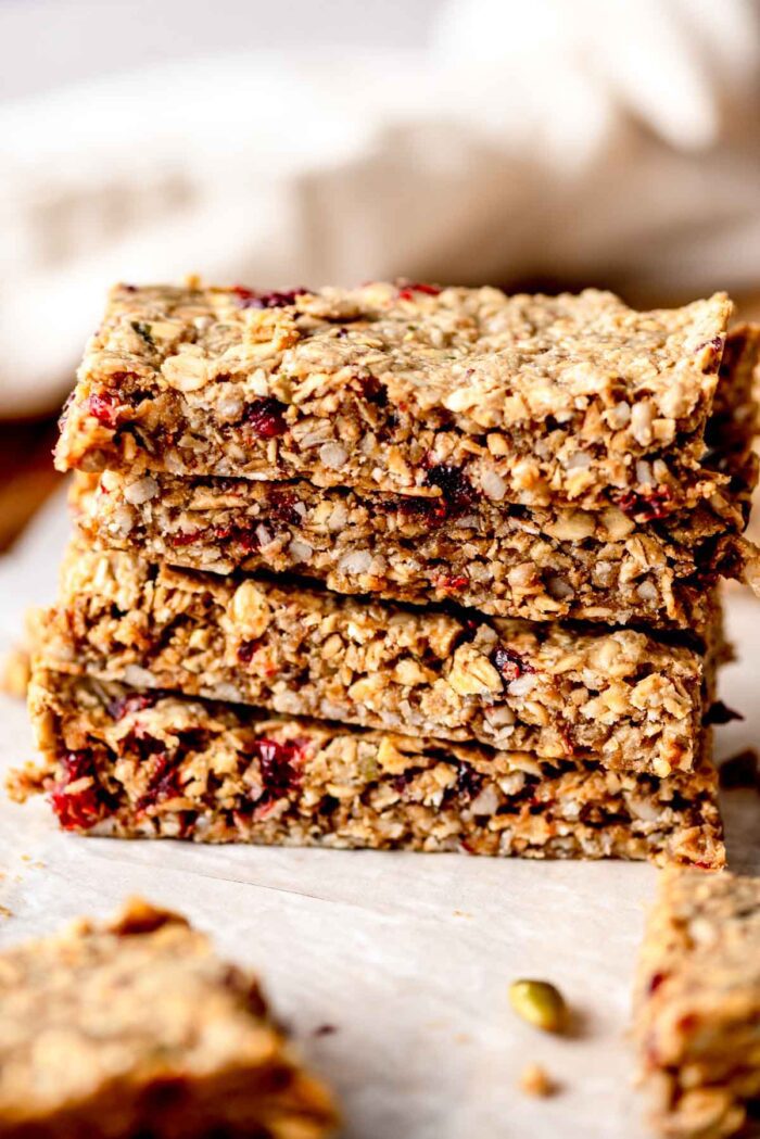 Stack of 4 baked cranberry granola bars.