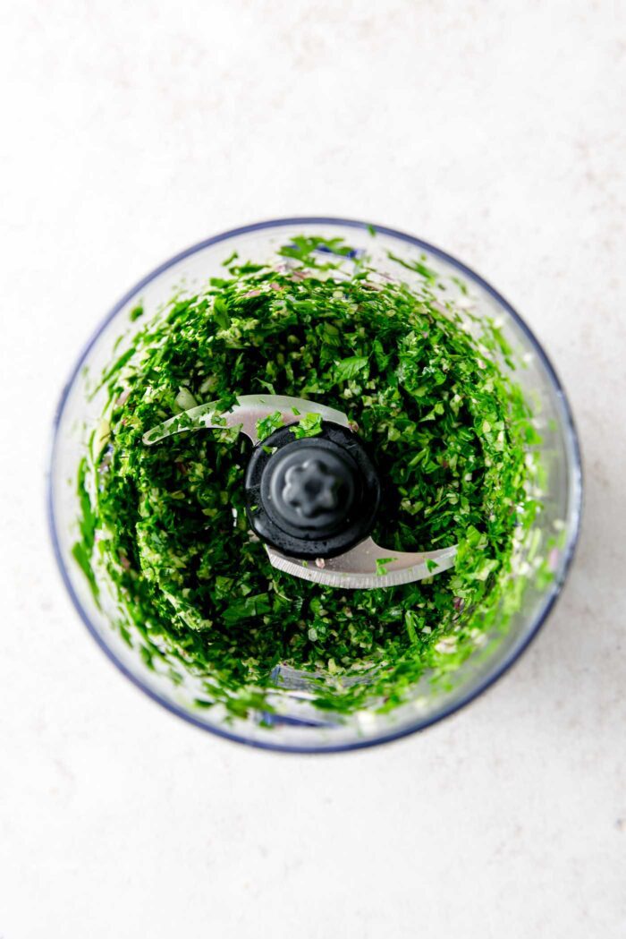 Chopped fresh herbs and shallot in a small food processor.