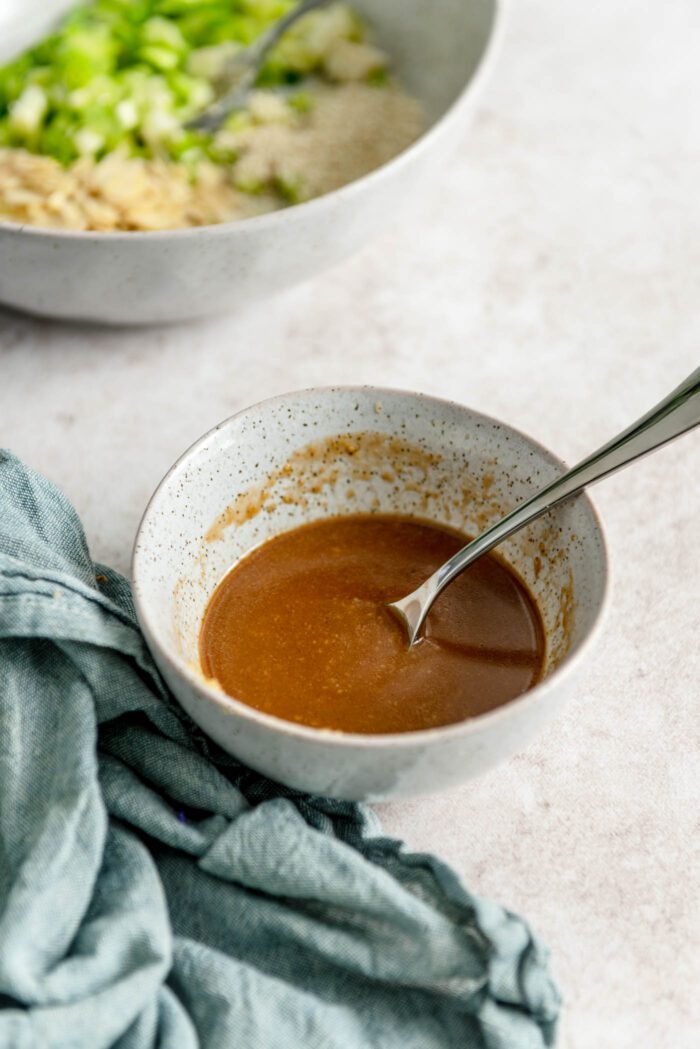 Miso dressing in a bowl with a spoon.