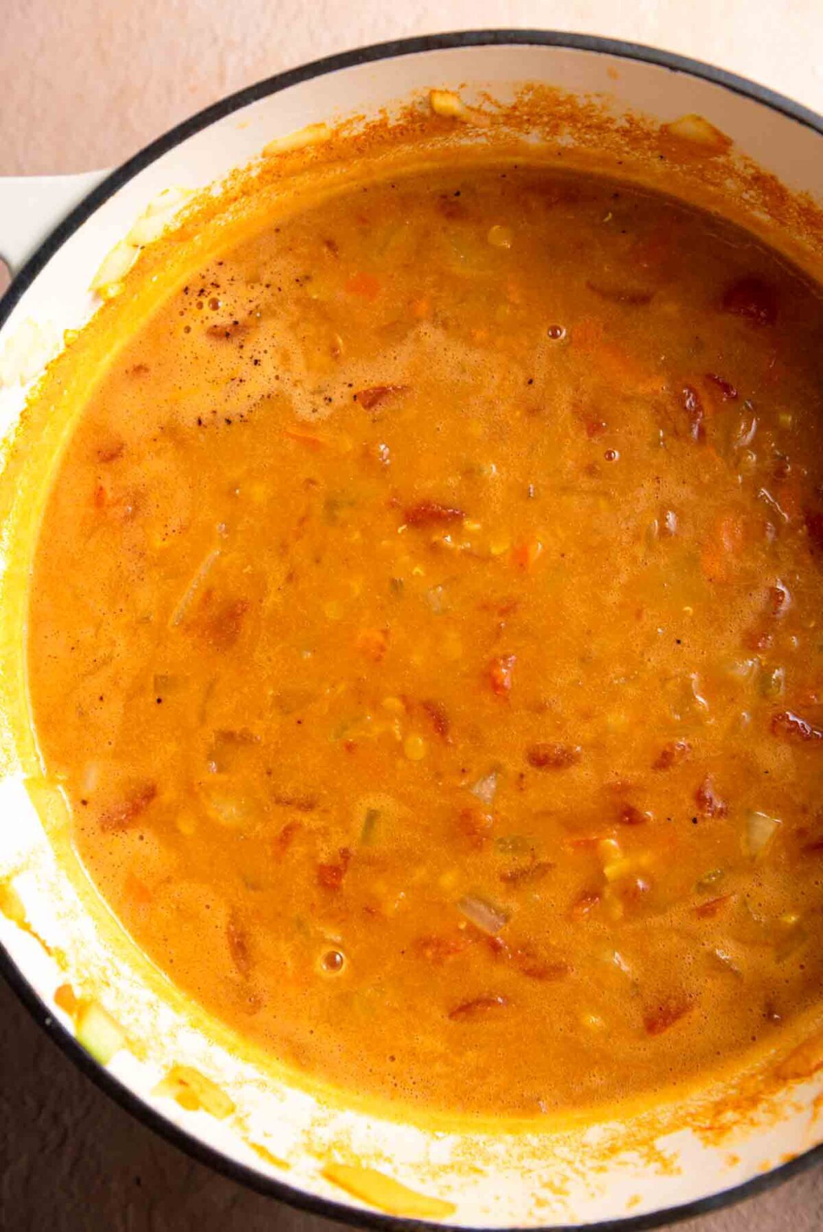 Curried tomato lentil chickpea soup in a large soup pot.