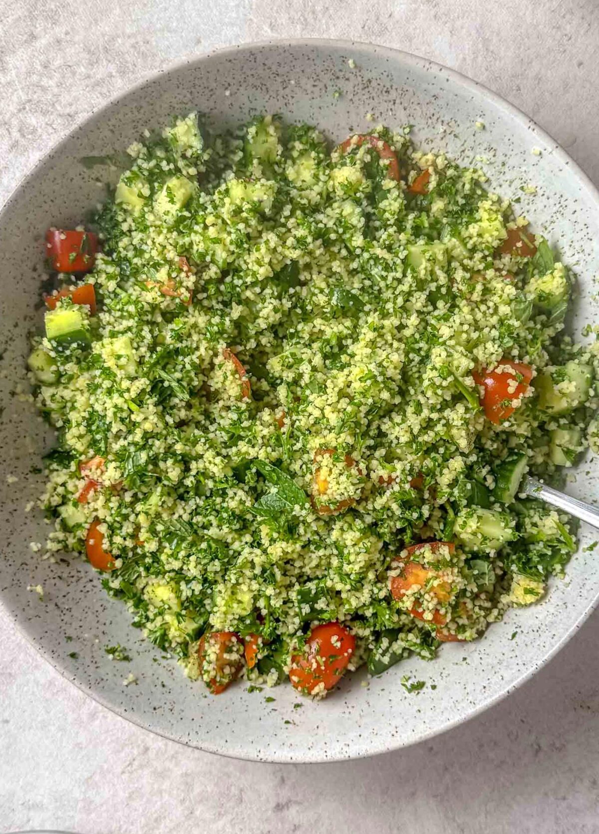 Couscous tabouleh in large bowl.