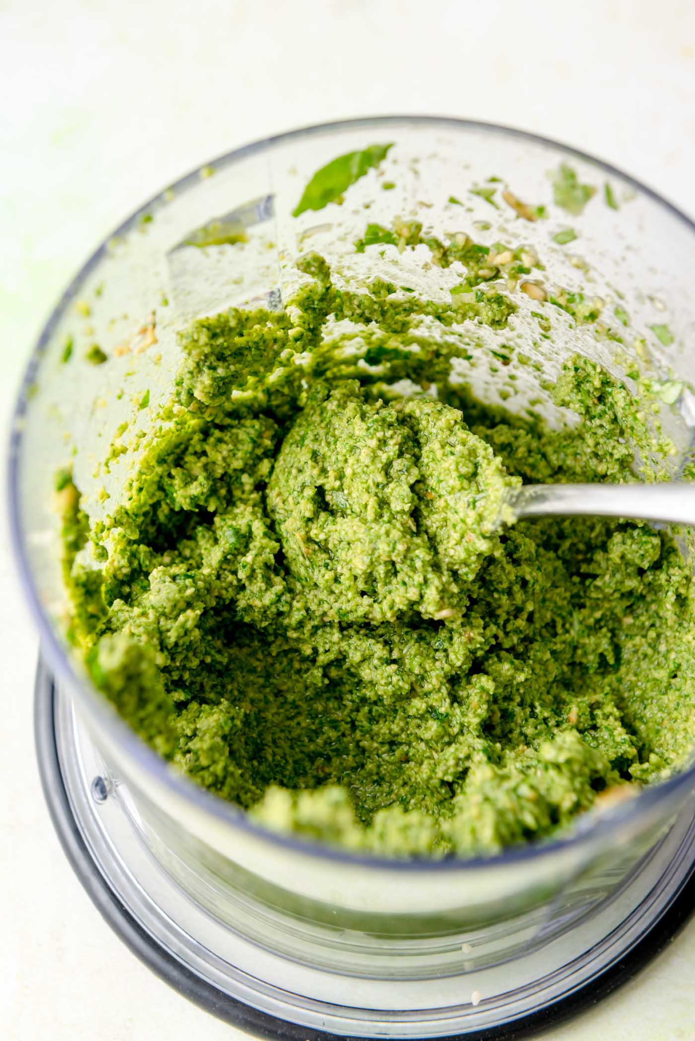 Thick, vibrant green pumpkin-seed pesto blended in a food processor.