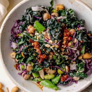 Miso crunch sesame salad with kale, cabbage, chickpeas, edamame, snap peas and cashews tossed in a creamy miso dressing.